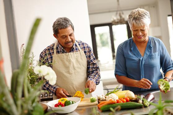Couple cooking together at home